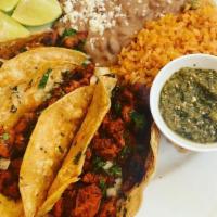 Taco Trio · Carne Asada, Guajillo Chicken or Chorizo Served on Corn Tortillas with Mexican Rice and Beans