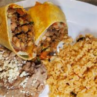 South Of The Border Burrito · Flour tortilla stuffed with chorizo sausage, marinated carne asada, Mexican potatoes, guacam...