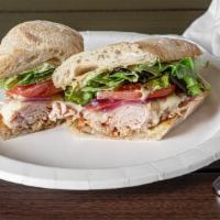 Spicy Melt Sub · Spicy: sharp, fiery taste. Smoked turkey under provolone with roasted red onions, tomatoes, ...