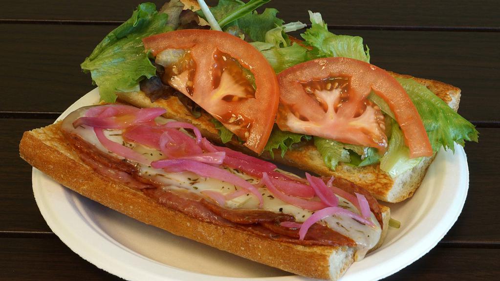 Italian Sub · Popular: a top-rated menu item. Salami and pepperoni under provolone with red onions, tomatoes, and organic greens on a french baguette.
