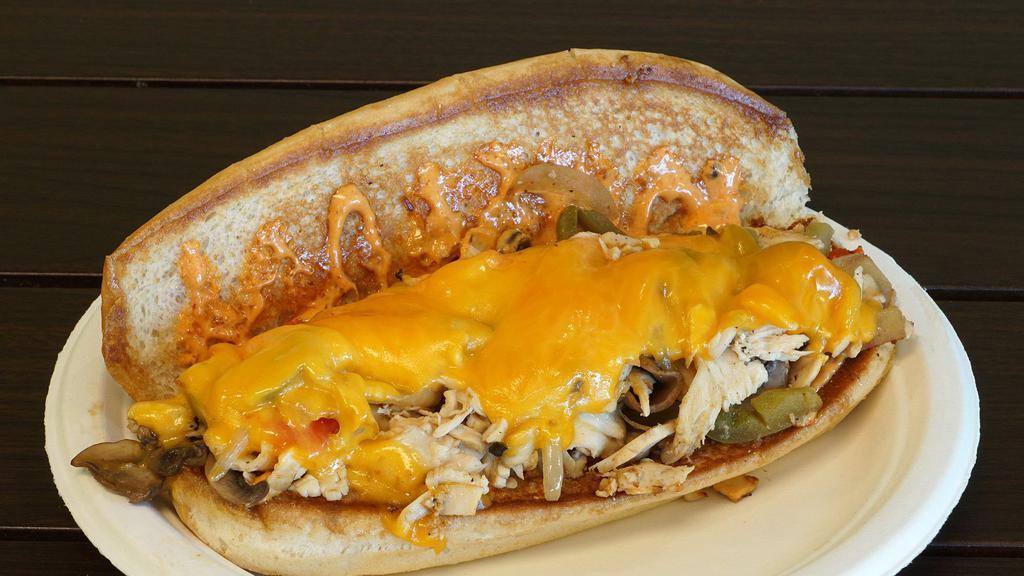 Chicken Philly · Roasted chicken under cheddar with grilled red peppers, green peppers, grilled onions, grilled mushrooms and chipotle mayo on a hoagie roll