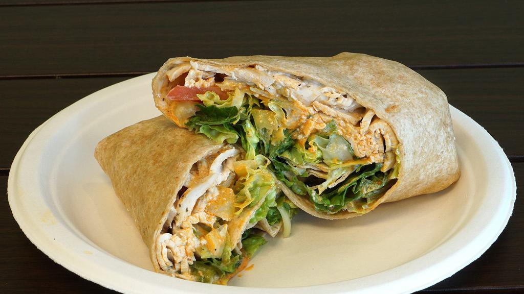 Buffalo Chicken Wrap · roasted chicken under blue cheese with buffalo sauce, ranch, celery, romaine lettuce and tomatoes on a wheat wrap.
