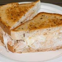 Rachel · turkey and sauerkraut under melted swiss cheese with homemade Russian dressing on rye bread.