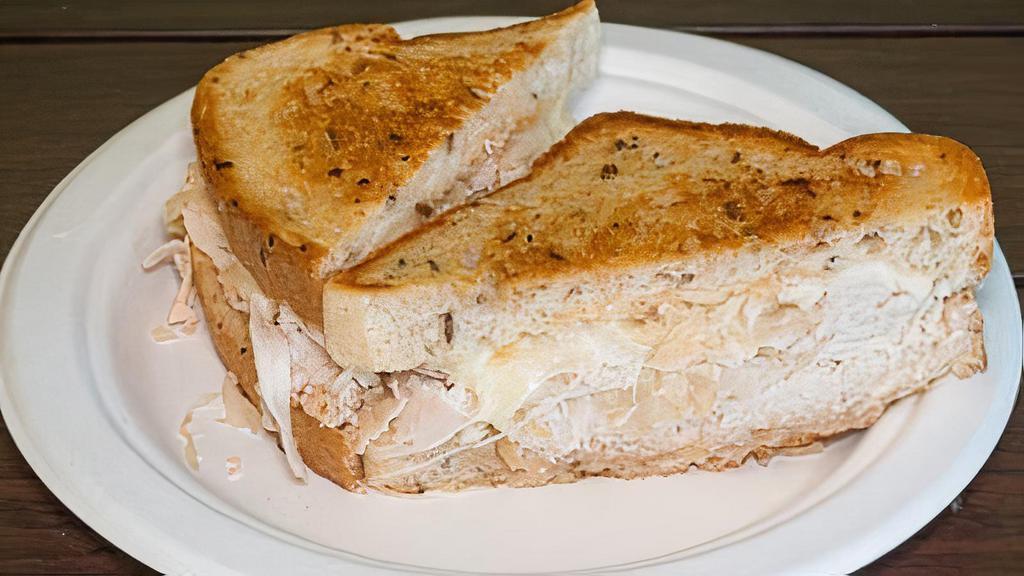 Rachel · turkey and sauerkraut under melted swiss cheese with homemade Russian dressing on rye bread.