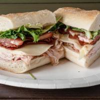 Club Sub · Roasted turkey and ham with bacon, provolone, tomatoes, organic greens, and house-made honey...