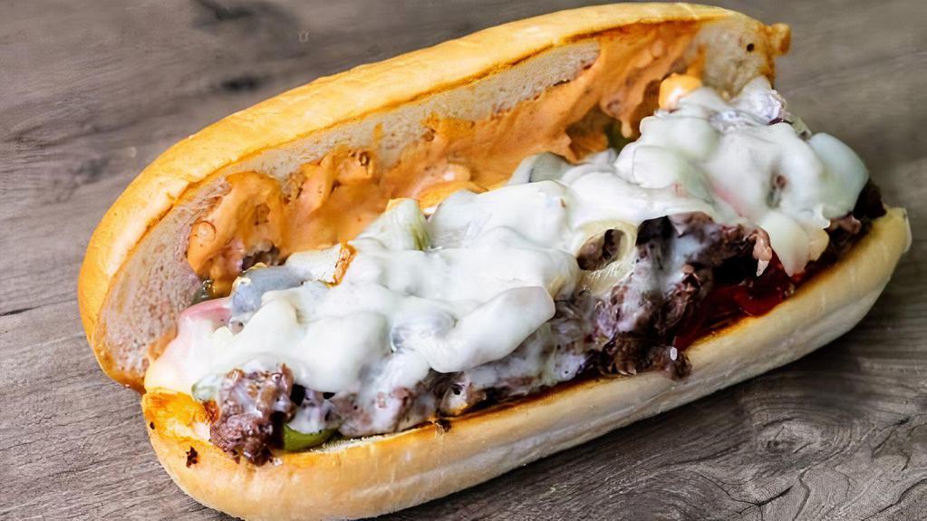 Chipotle Cheesesteak · Grilled fresh ribeye steak with grilled green peppers, grilled red peppers, grilled onions, and chipotle mayonnaise under provolone cheese on a hoagie roll.