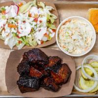 Burnt Ends Plate · 8oz of burnt ends served with pickles, raw onions, and a bun. Comes with a choice of 2 sides.