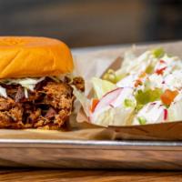 Pulled Pork Sandwich · Pulled pork served on a bun with crispy fried onions and coleslaw. Comes with a  choice of 1...