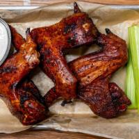 Whole Chicken Wings · Smoked whole chicken wings served with house sauce and celery. Choose from 3 or 6 wings.