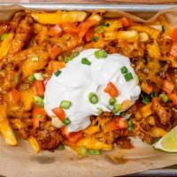 Chili Cheese Fries · House cut french fries covered in brisket chili and melted cheese. Layered with a dollop of ...