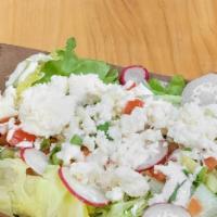 House Salad · House sauce, radishes, tomatoes, green onions, and Queso Fresco on top a bed of lettuce.