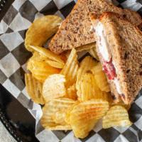 Farm American · Roast turkey breast with cranberry sauce, dill mayo and fresh sage on cranberry oat bread.