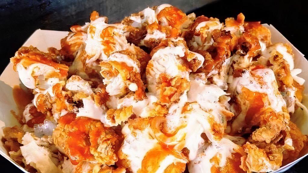 Hot Tots · Tater Tots, Smothered with Cheese, Buffalo Sauce & Ranch.