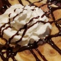 Sweet Treat · Deep Fried Flour Tortilla Dusted with Cinnamon and Sugar, Topped with Chocolate Syrup and Wh...