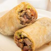 Carne Asada Craze Burrito  · Grilled sirloin steak topped with sour cream, salsa, cheese, and refried beans wrapped in a ...