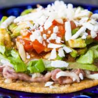 Tostadas Turn Up  · Refried beans, lettuce, tomatoes, sour cream, & cheese.