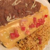 Uno · Cheese & onion enchilada with chili con carne & a crispy beef taco. With rice & re-fried bea...