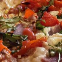 Basil Prosciutto Pizza · Basil pesto sauce, fresh mozzarella, feta cheese, artichokes, green olive.