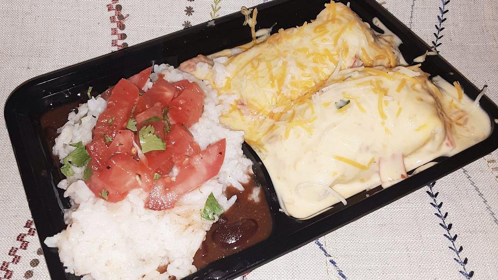 Chicken Enchilada Meal · Two chicken enchiladas, soul seasoning, onion, queso, pico de gallo, and flour tortillas. Pinto beans & rice is included.