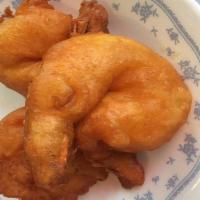 Shrimp Pakora (6 Pcs.) · Wrapped in chickpeas flour, deep-fried and crispy.