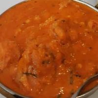 Chicken Curry · Boneless chicken cooked in spiced gravy.