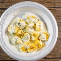 Cheese Tortellini With Alfredo (Half Tray) · Four to six servings. Topped with mozzarella cheese.