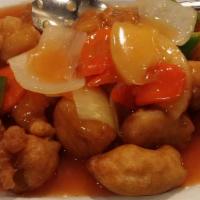 Sweet And Sour Pork · Deep fried breaded pork in sweet and sour sauce with pineapples onions and carrots.