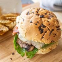 Angus M.A.C.C. Burger · Certified angus beef hamburger smothered with your choice of grilled M.A.C.C. N Cheese and u...