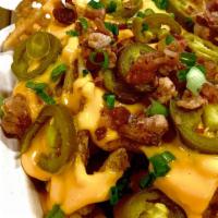 Loaded Waffle Fries · *Fries with tons of cheese, Bacon and Peppers piled on top.