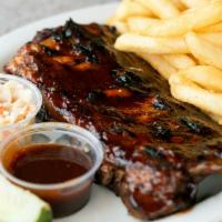 Half Slab Ribs · Served with garlic bread, cole slaw, pickle spear and choice of fries, baked potato, rice, o...