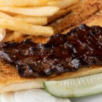 Skirt Steak Sandwich · Served on garlic bread with BBQ sauce, coleslaw, onion, pickles and choice of fries, oven br...