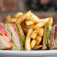 Turkey Club With Fries · Turkey Club served with lettuce, tomato, mayo, turkey and bacon with american cheese. Choice...