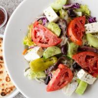 Greek Salad · Lettuce, tomato, cucumber, onion, olives, feta, pepperoncini, anchovies and oregano. Housema...