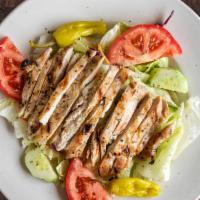 Grilled Chicken Salad · Tomato, cucumber, pepperoncini, sliced 8 oz chicken breast over a bed of lettuce. Served wit...