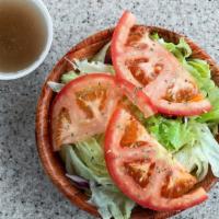 Tossed Salad · Tomato & cucumber on a bed of lettuce.
