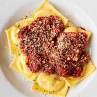 Meat Ravioli · Served with meat or marinara sauce, garlic bread and parmesan.