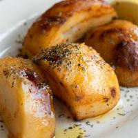 Oven Brown Potatoes · Thick-cut potatoes, tossed in olive oil & Greek herbs, cooked to golden brown.