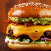 The Zamunda Club · Half-pound burger, bacon, cheddar cheese, avocado, lettuce, tomato, and Shai-King sauce.