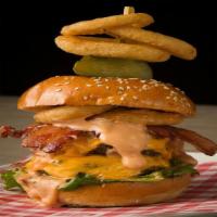 The Finesse Burger · Half-pound burger, Shai-King sauce, cheddar cheese, bacon, onion rings, lettuce, and tomato.
