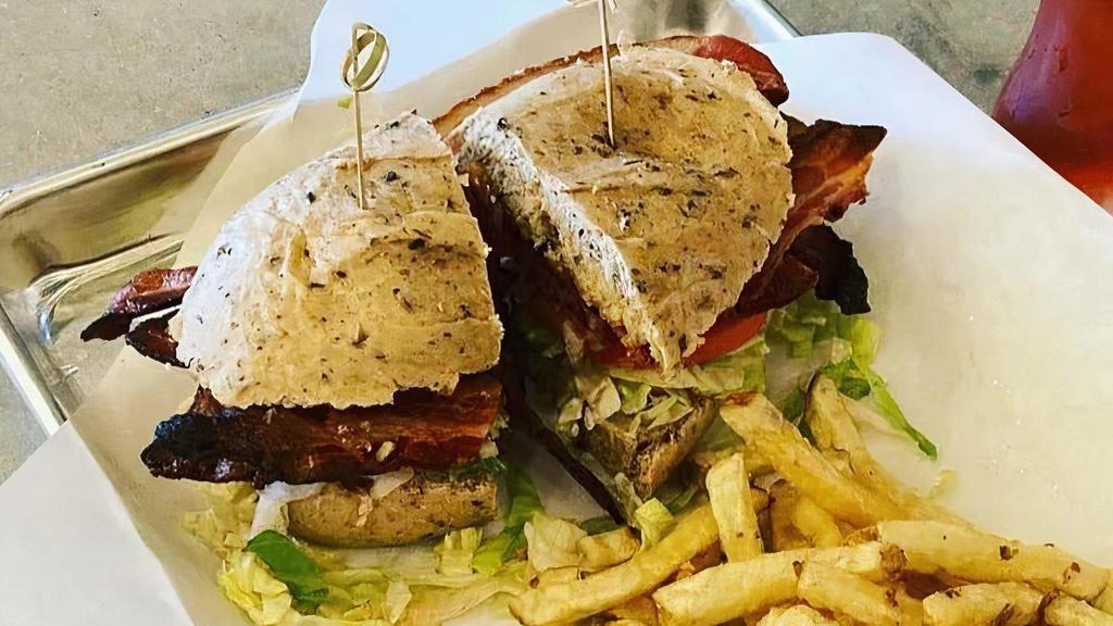 Stacked Blt · 6 strips of local Bacon, lettuce, tomato & garlic aioli. 

Served with Fries