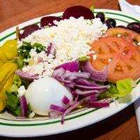 Greek Salad · Lettuce, tomatoes, onions, cucumbers, beets, eggs, pepperoncini, olives and feta cheese. Add...