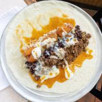 The Big Popper · Ground beef, cilantro lime white rice, black beans, cream cheese jalapeño poppers, queso bla...