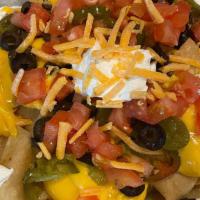 Classic Nachos · BP classic nachos are a dozen corn tortillas, cut, fried and generously topped with nacho ch...