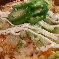 Chorizo Bean Dip · Homemade refried bean and chorizo with chihuahua cheese on top served with homemade tortilla...