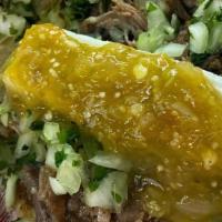 Verde Pork Taco · Pulled pork, Queso Fresca, green salsa,  cilantro and Onions