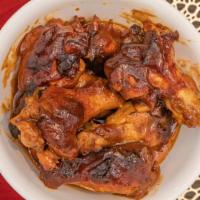 Bbq Jerk  Wings  · PJ's special. Seasoned with authentic Jamaican jerk sauce and made in the US BBQ sauce, thes...