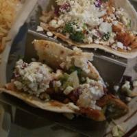 Tacos Al Pastor · Three tacos filled with marinated steak, chorizo, pineapple. Topped with fresh cilantro and ...