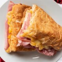 The Ham & Cheese · Our three cheese blend of mozzarella, monterey jack, and cheddar with sliced ham on a toaste...