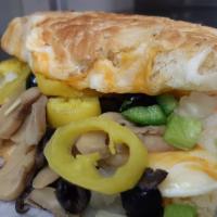 The Veggie · Our three cheese blend of mozzarella, monterey jack, and cheddar with mushroom, onion, black...