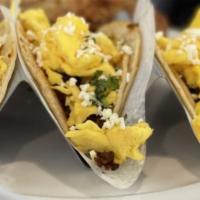 Breakfast Tacos · Gluten-free. choice of chorizo or mojo pork, scrambled egg, cotija, cilantro, onion, corn to...